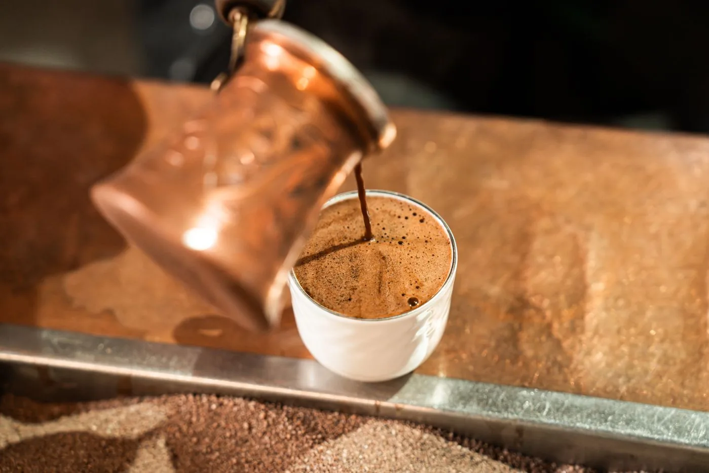 Dallah pouring Arabic coffee